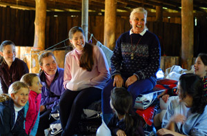 Carol Heuchan with kids in a barn